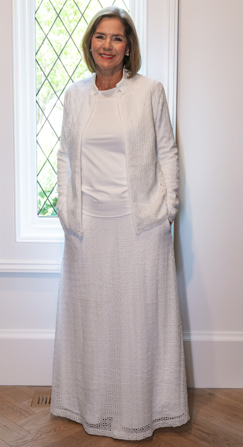 Elegant white lace LDS Temple suit featuring a zip-up jacket with pockets and a flowing A-line skirt
